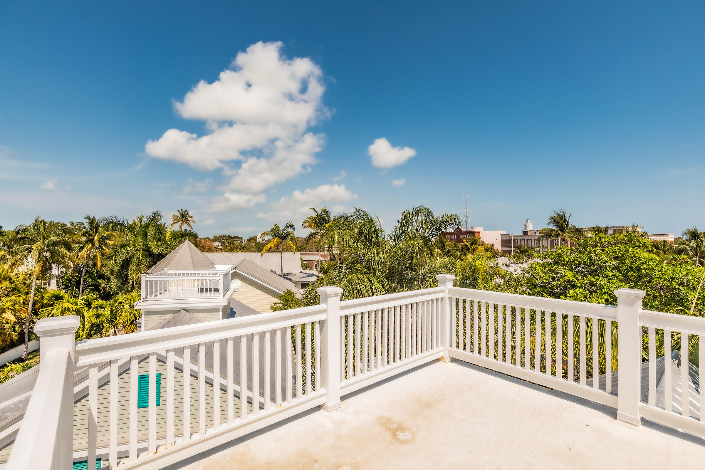 66 Front Street Key West, FL 33040 - Photo 7 of 8 a view of a balcony with wooden fence