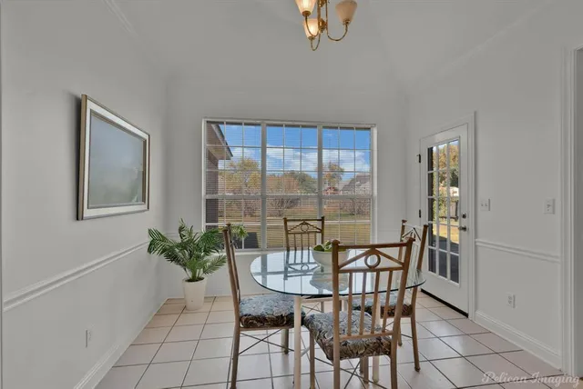 a view of a dining room with furniture and window