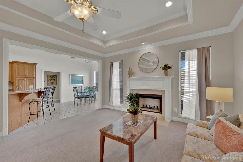 1413 Magnolia Ridge Bossier City, LA 71112 - Photo 13 of 29 a living room with furniture a fireplace and a table