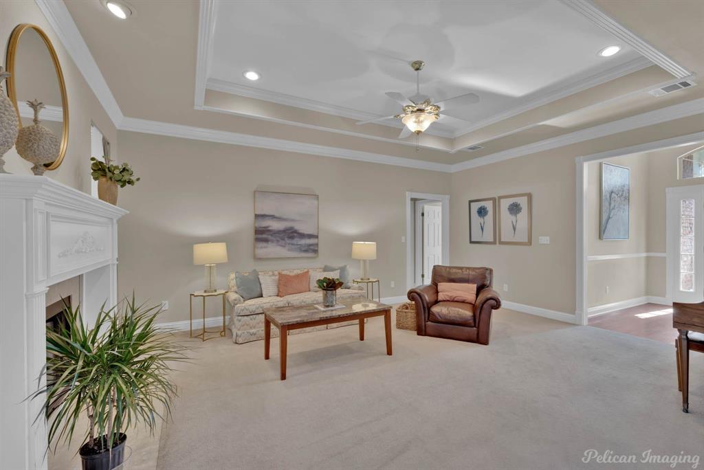 1413 Magnolia Ridge Bossier City, LA 71112 - Photo 14 of 29 a living room with furniture and a chandelier
