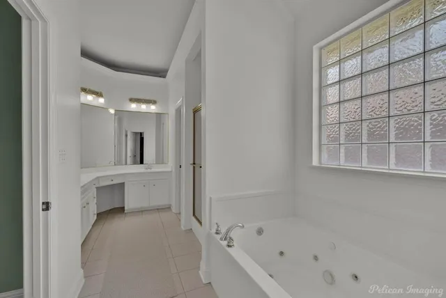 a bathroom with a bathtub and a shower