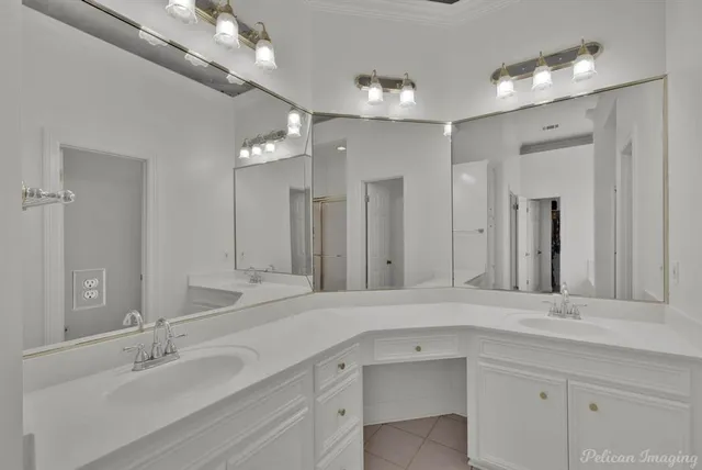 a bathroom with a sink double vanity and a mirror