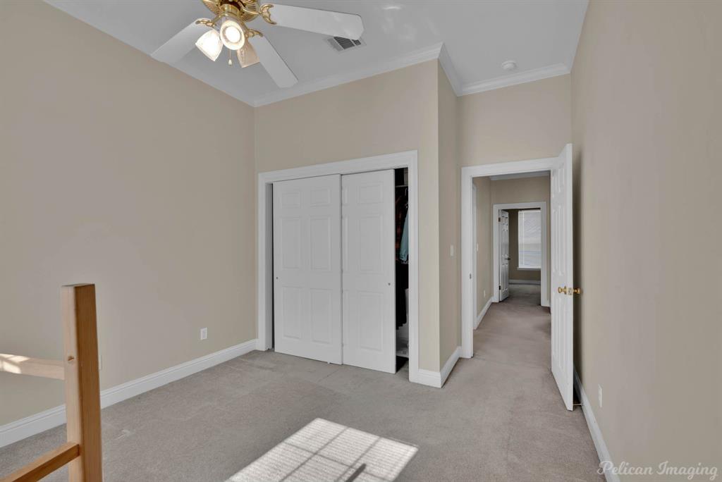 1413 Magnolia Ridge Bossier City, LA 71112 - Photo 25 of 29 a view of a hallway with a chandelier fan