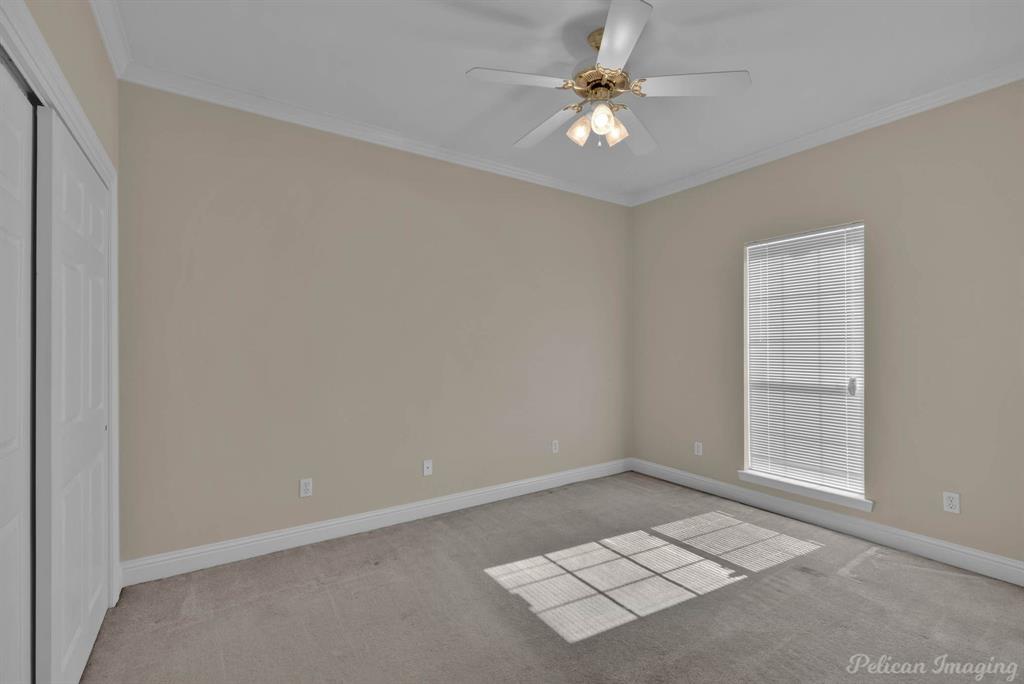 1413 Magnolia Ridge Bossier City, LA 71112 - Photo 26 of 29 an empty room with windows and fan
