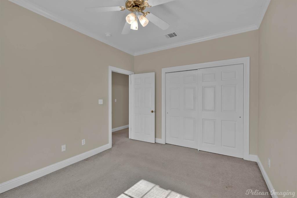 1413 Magnolia Ridge Bossier City, LA 71112 - Photo 27 of 29 a view of an empty room with a chandelier fan