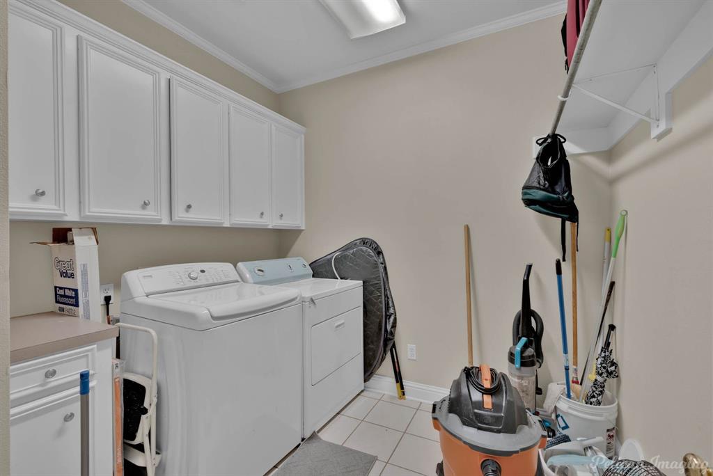 1413 Magnolia Ridge Bossier City, LA 71112 - Photo 29 of 29 a utility room with dryer and washer