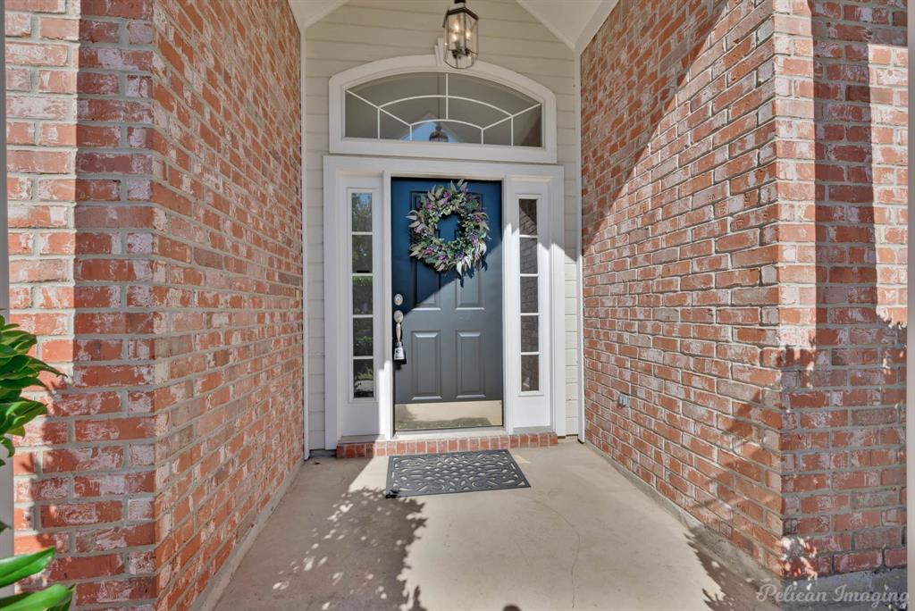 1413 Magnolia Ridge Bossier City, LA 71112 - Photo 3 of 29 a front view of a house with a door