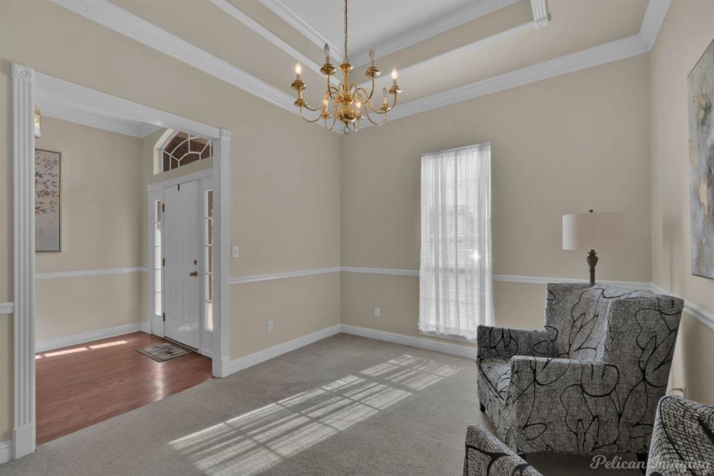 1413 Magnolia Ridge Bossier City, LA 71112 - Photo 5 of 29 a living room with furniture and a chandelier