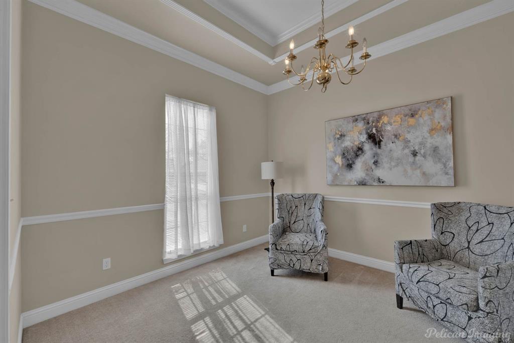 1413 Magnolia Ridge Bossier City, LA 71112 - Photo 6 of 29 a living room with furniture and a chandelier