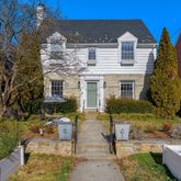 a view of a house with sitting area and garden