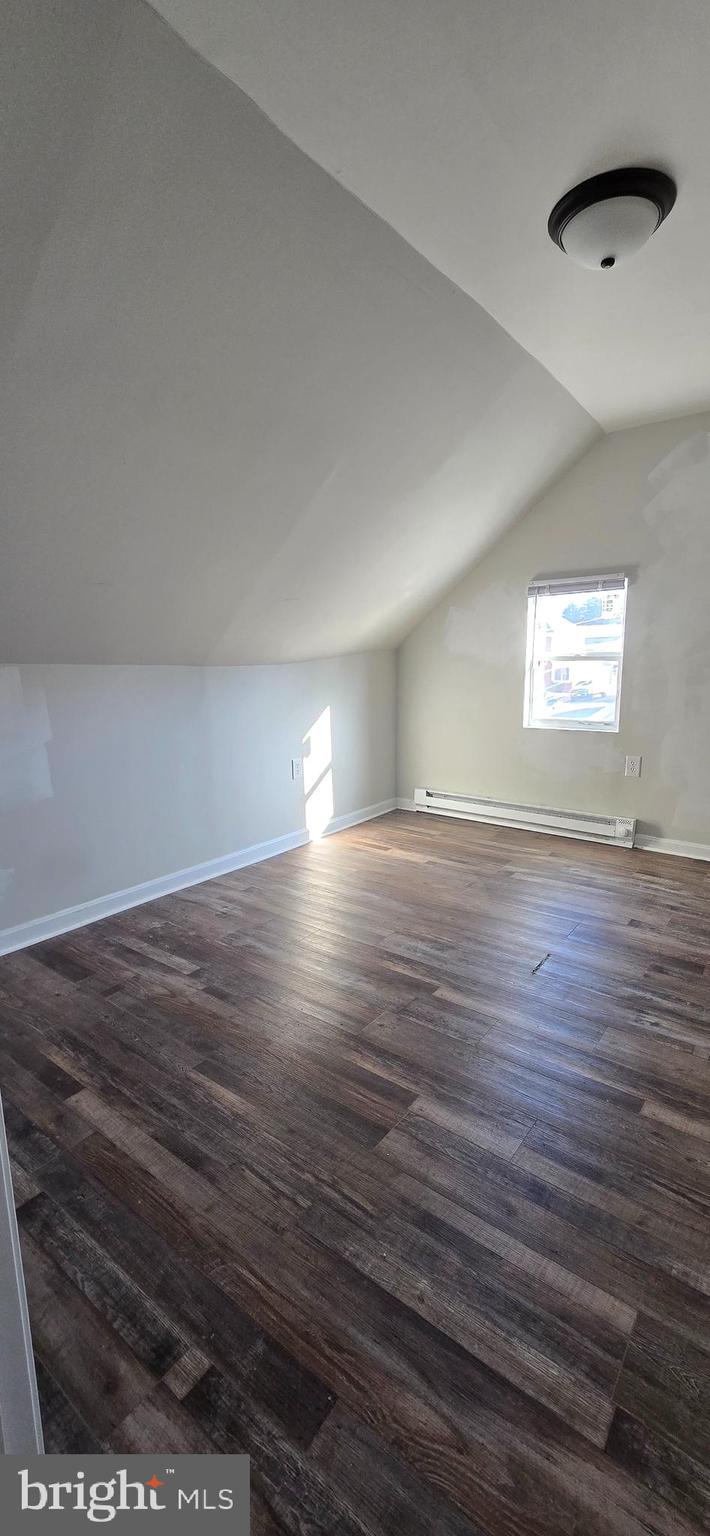 29 North Main Street, Unit B Smithsburg, MD 21783 - Photo 12 of 15 an empty room with wooden floor and windows