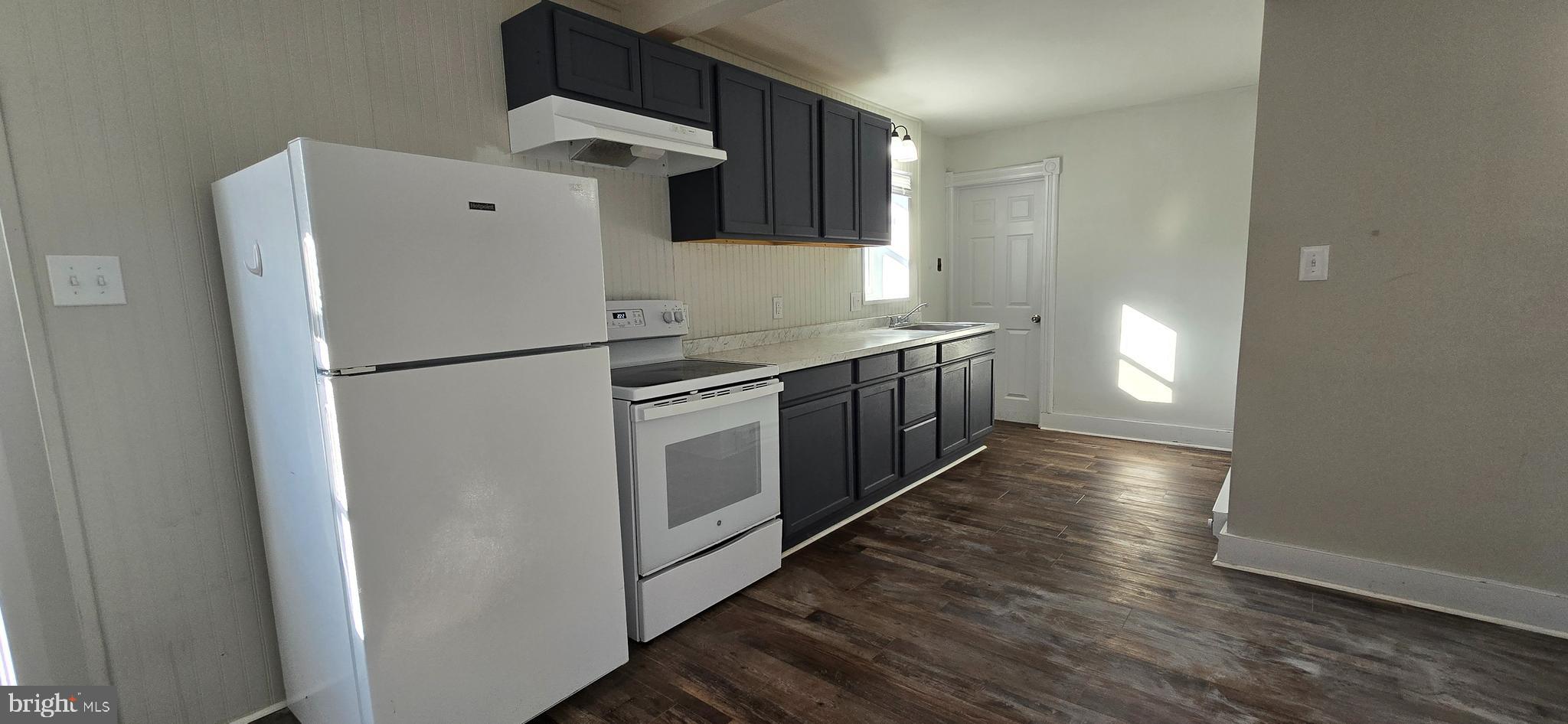 29 North Main Street, Unit B Smithsburg, MD 21783 - Photo 5 of 15 a kitchen with stainless steel appliances a refrigerator and a stove top oven