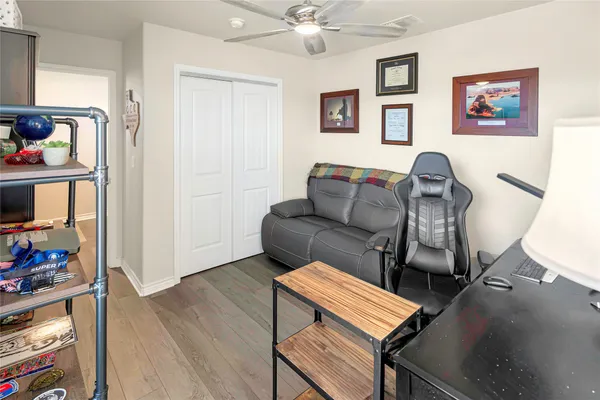 a workspace with a couch and a window