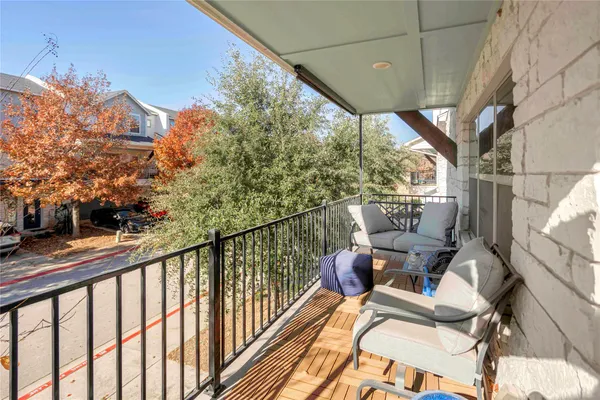 a view of balcony with furniture