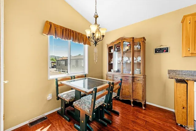 a dining room with furniture and window