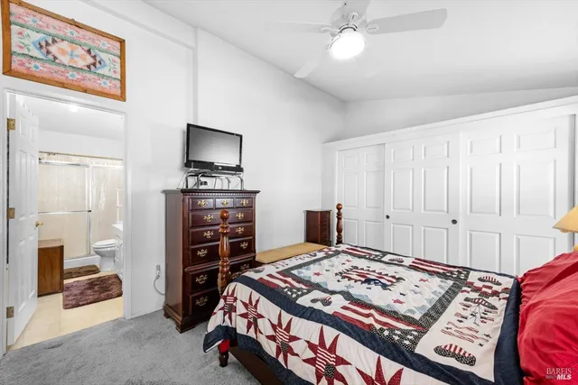 a bedroom with a bed and a book shelf