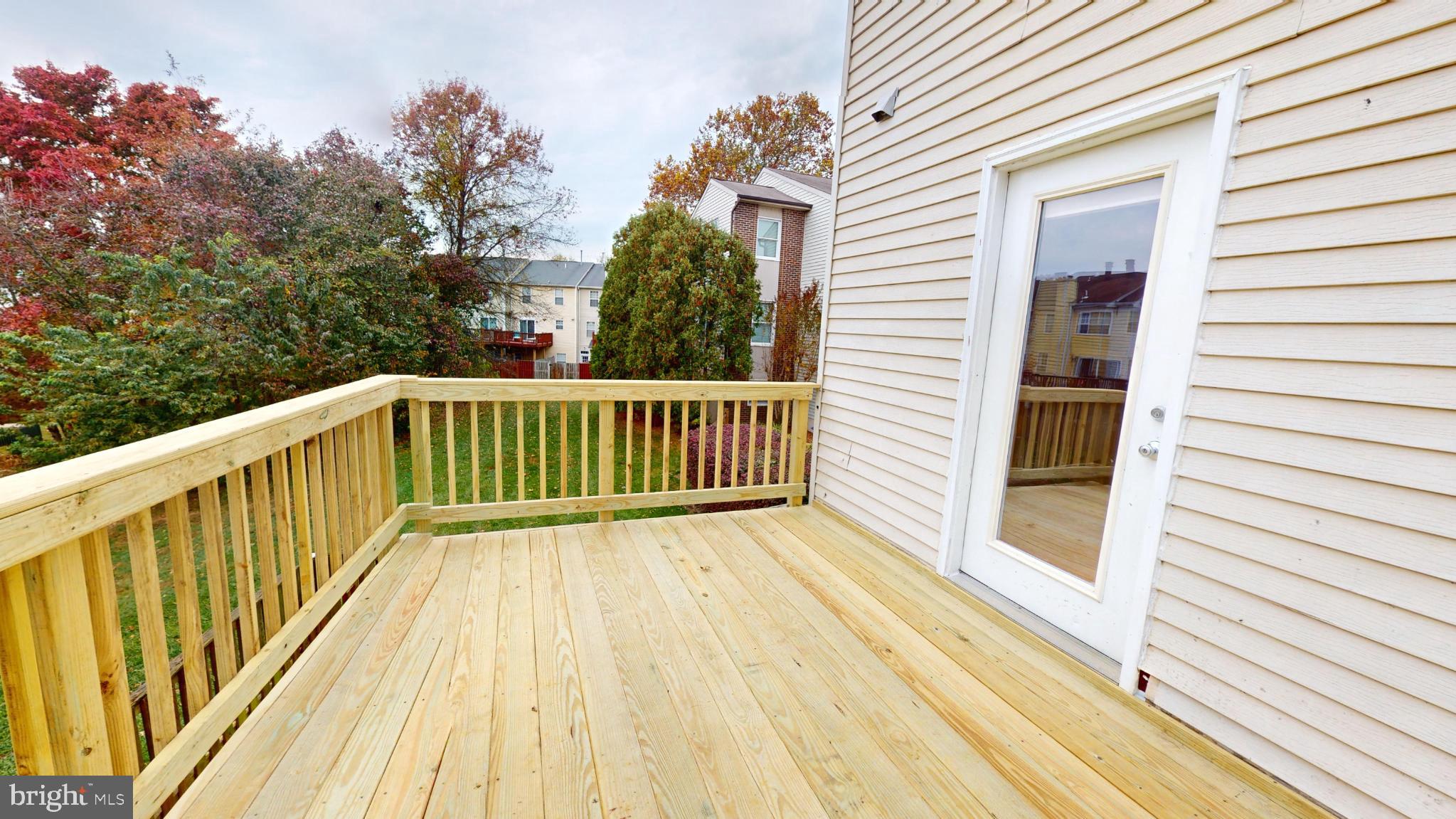 2535 Vineyard Lane Crofton, MD 21114 - Photo 17 of 18 Spacious deck overlooking lush greenery.