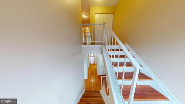 a view of staircase with black and white walls