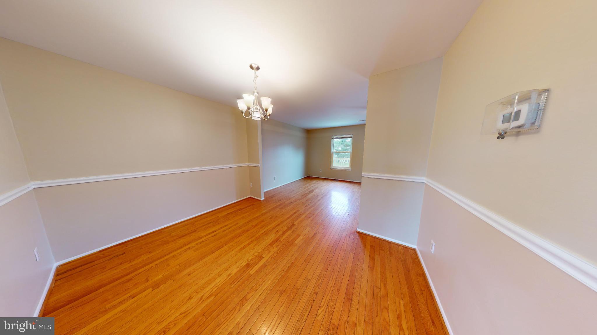 2535 Vineyard Lane Crofton, MD 21114 - Photo 5 of 18 Spacious room with warm wooden floors.