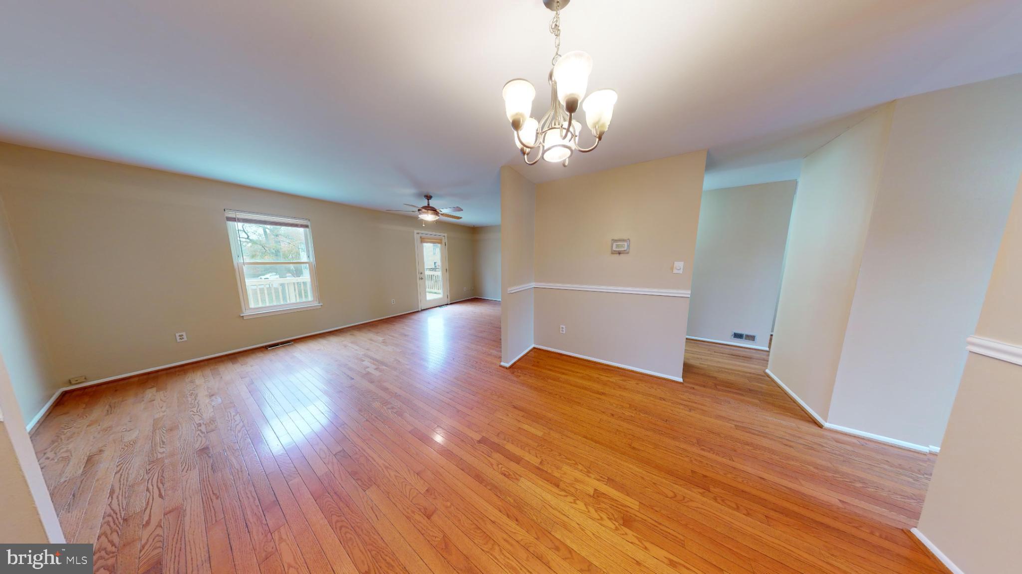 2535 Vineyard Lane Crofton, MD 21114 - Photo 7 of 18 Spacious room with warm wooden floors.