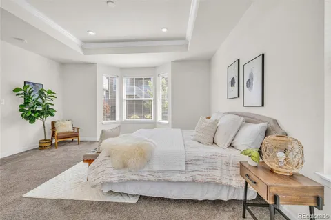 a bedroom with bed and window
