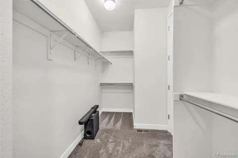 a view of an empty walk in closet