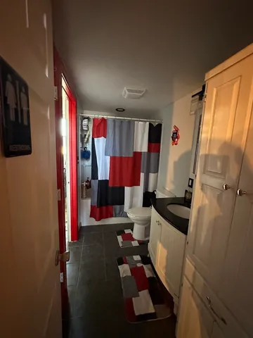 a living room with furniture and a rug