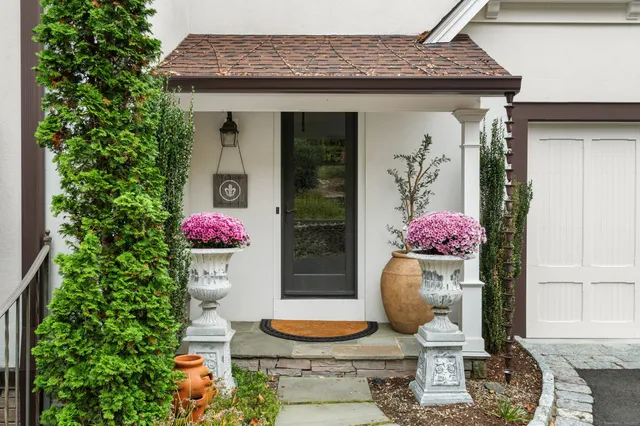 a front view of a house with yard