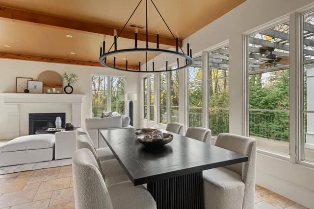 a view of a dining room with furniture window and outside view