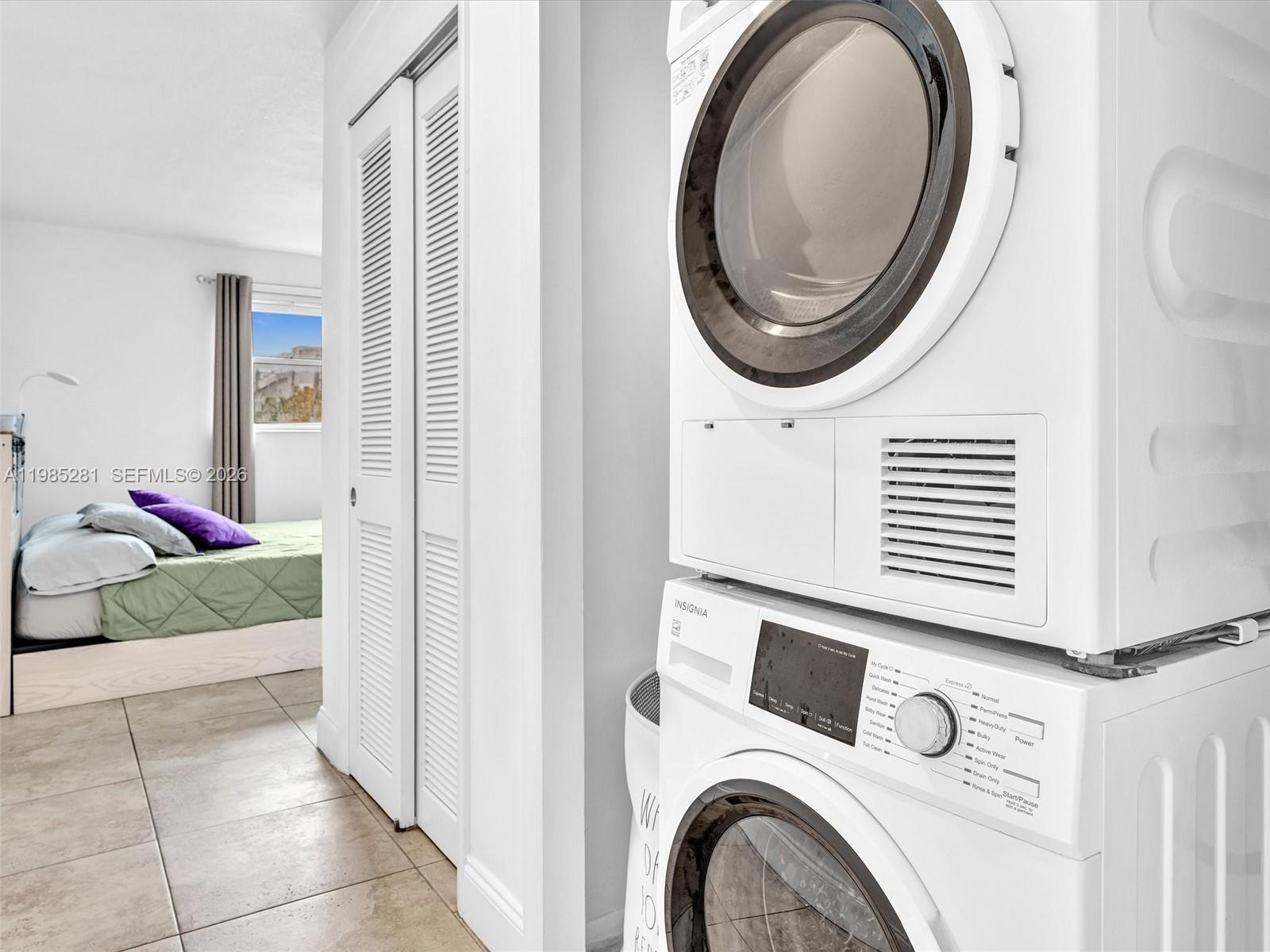 1236 Alton Road, Unit 304 Miami Beach, FL 33139 - Photo 21 of 28 a utility room with dryer and washer