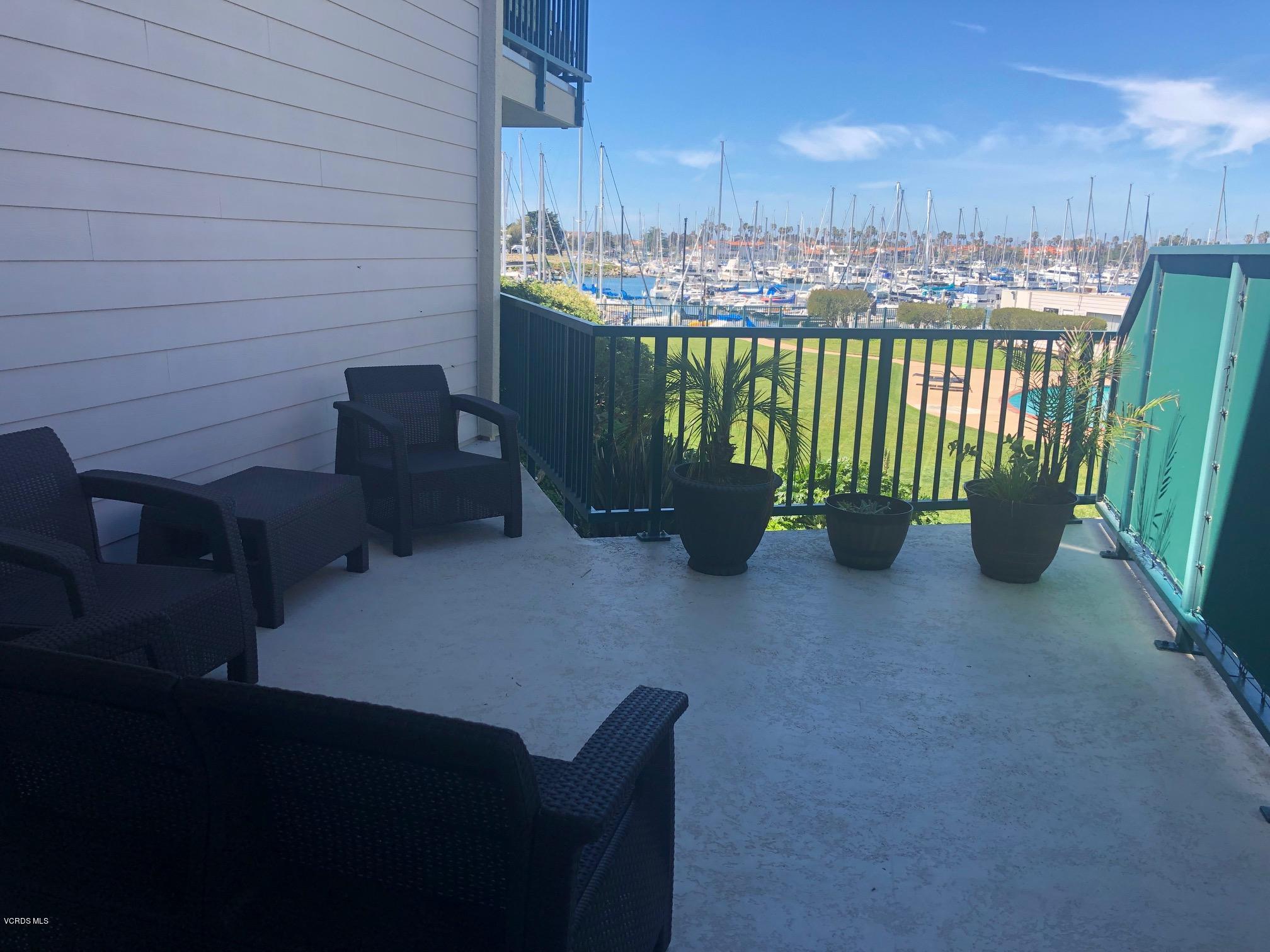 3101 Peninsula Road, Unit 104 Oxnard, CA 93035 - Photo 3 of 29 a view of a chairs and table in the balcony