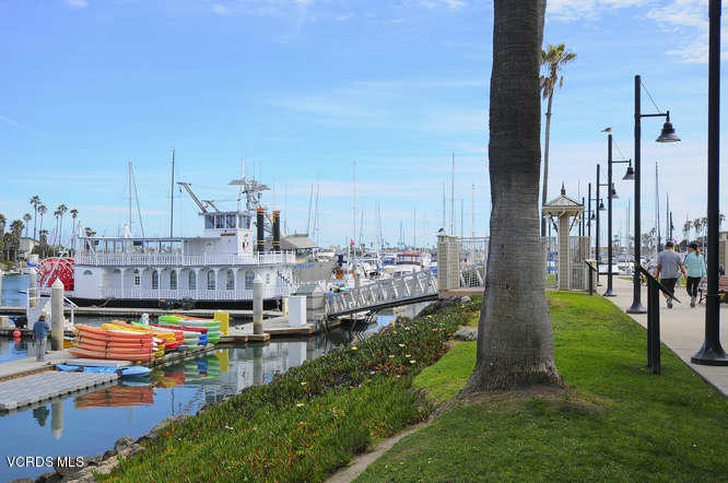 3101 Peninsula Road, Unit 104 Oxnard, CA 93035 - Photo 26 of 29 a view of swimming pool yard outdoor seating and city view