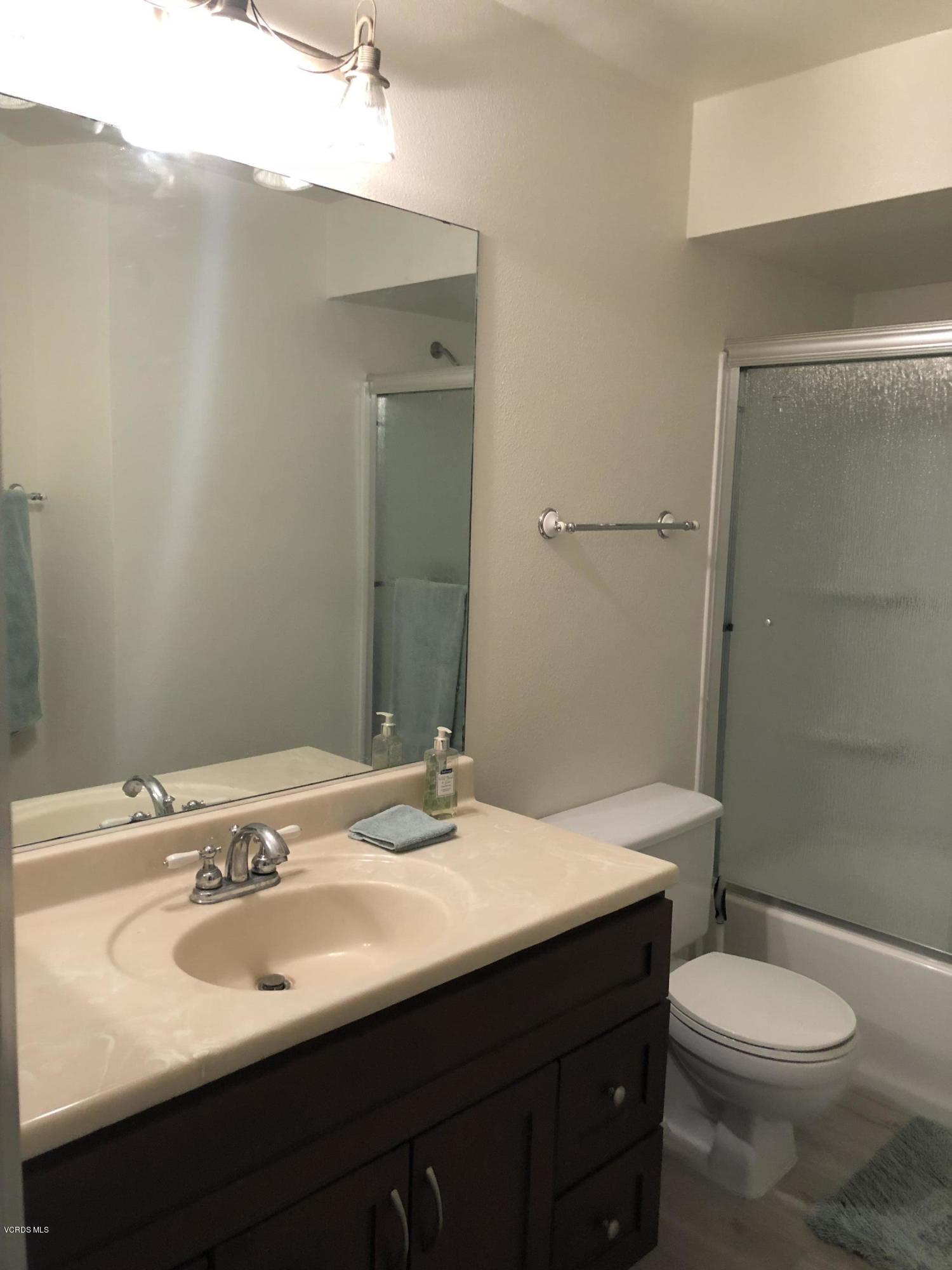 3101 Peninsula Road, Unit 104 Oxnard, CA 93035 - Photo 8 of 29 a bathroom with a sink toilet and shower