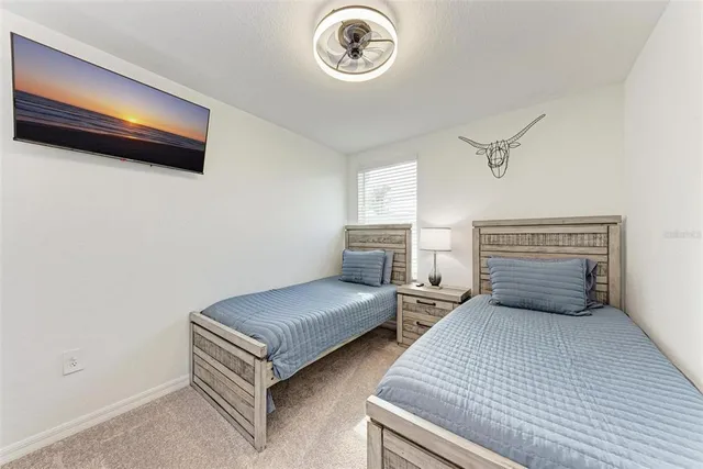 a bedroom with bed and a window