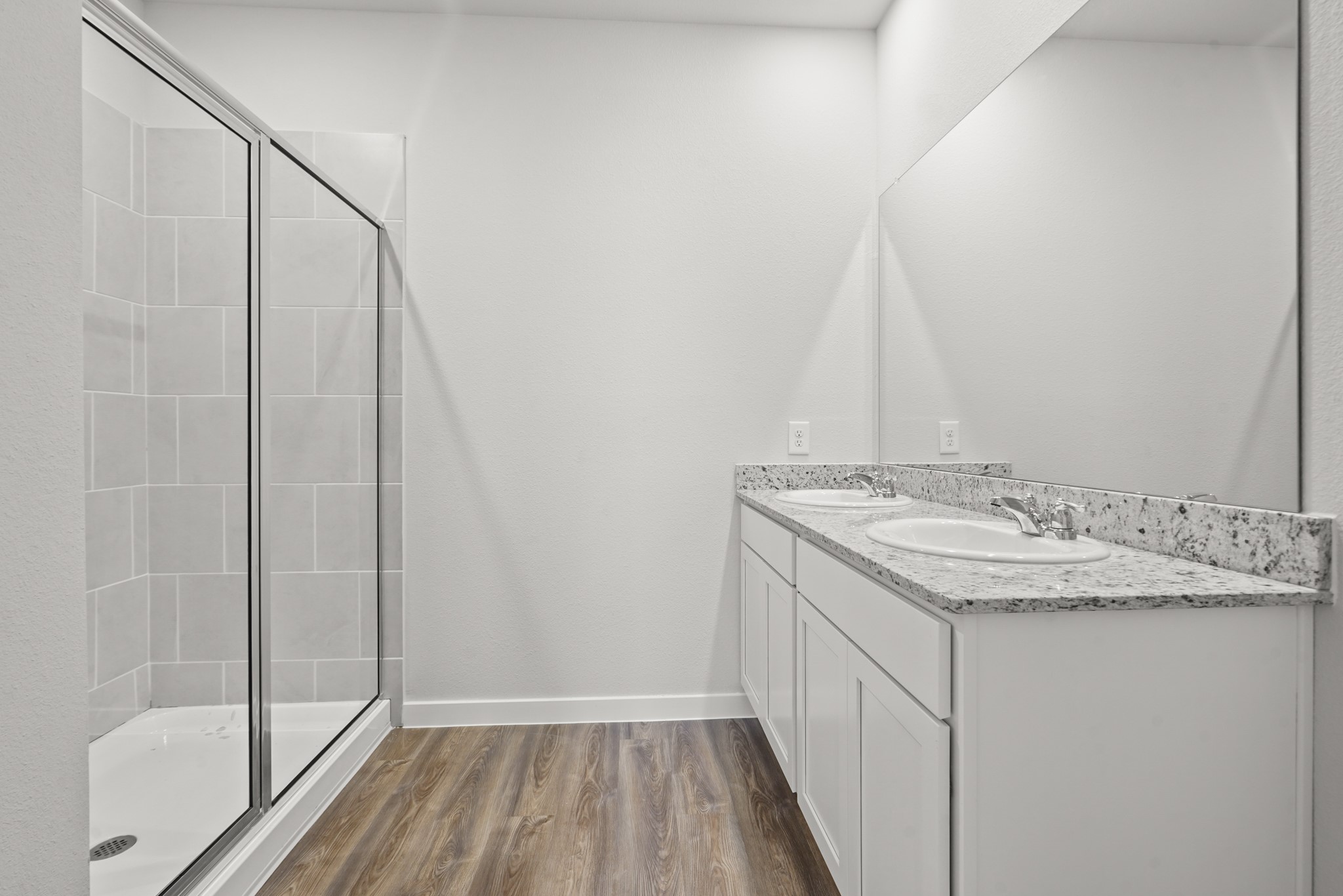 9720 Caney Bend Road Conroe, TX 77303 - Photo 10 of 24 a bathroom with a granite countertop sink and a mirror