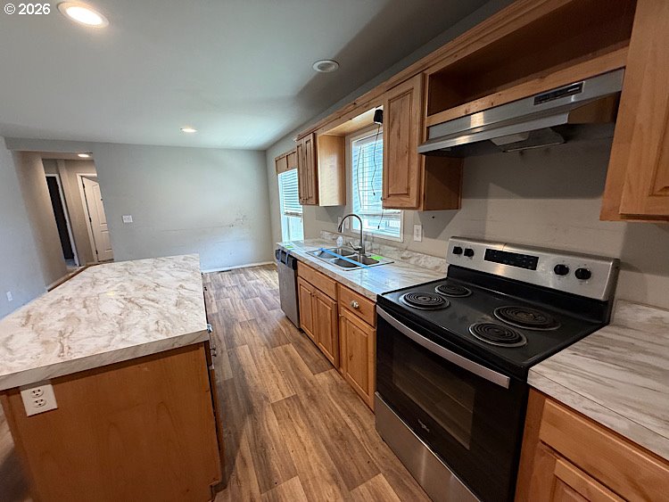 16125 Hawks Lair Road La Pine, OR 97739 - Photo 13 of 35 a kitchen with a stove and a sink