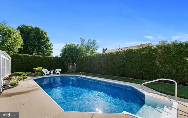 a view of a swimming pool with patio