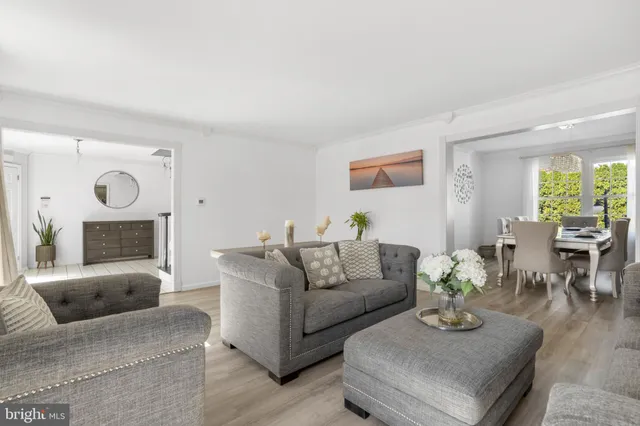 a living room with fireplace furniture and a window