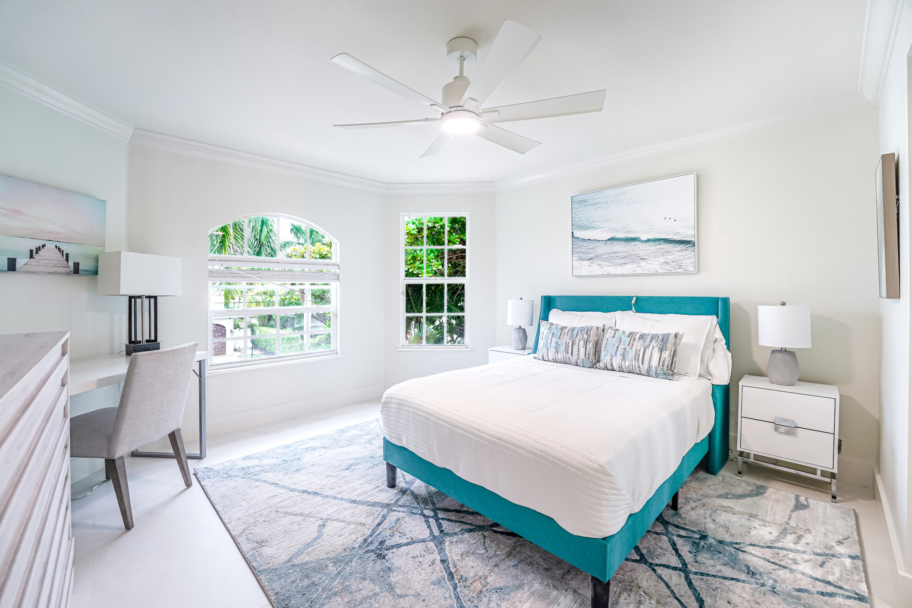 749 Northeast 71st Street Boca Raton, FL 33487 - Photo 26 of 43 a bedroom with a bed a painting on the wall and a large window