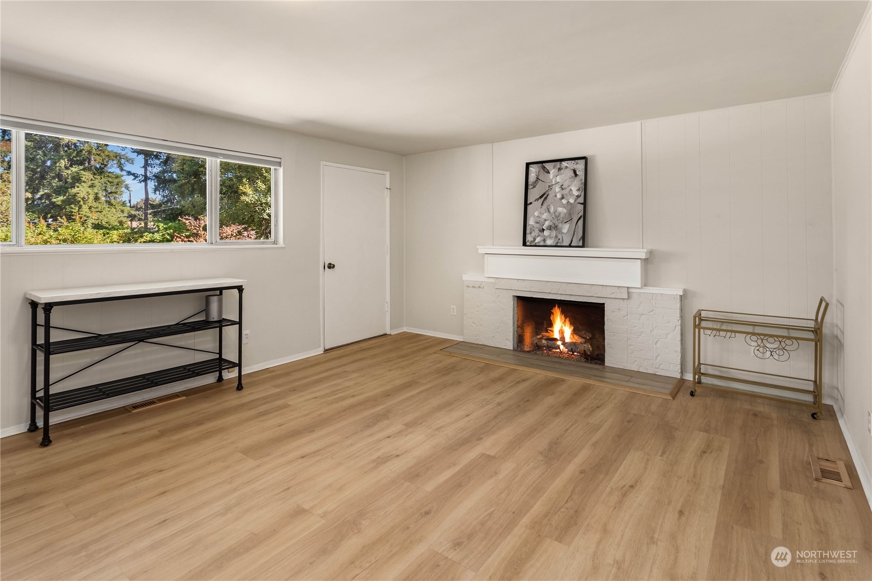 4418 Northeast 18th Court Renton, WA 98059 - Photo 12 of 22 a view of an empty room with a fireplace and a window