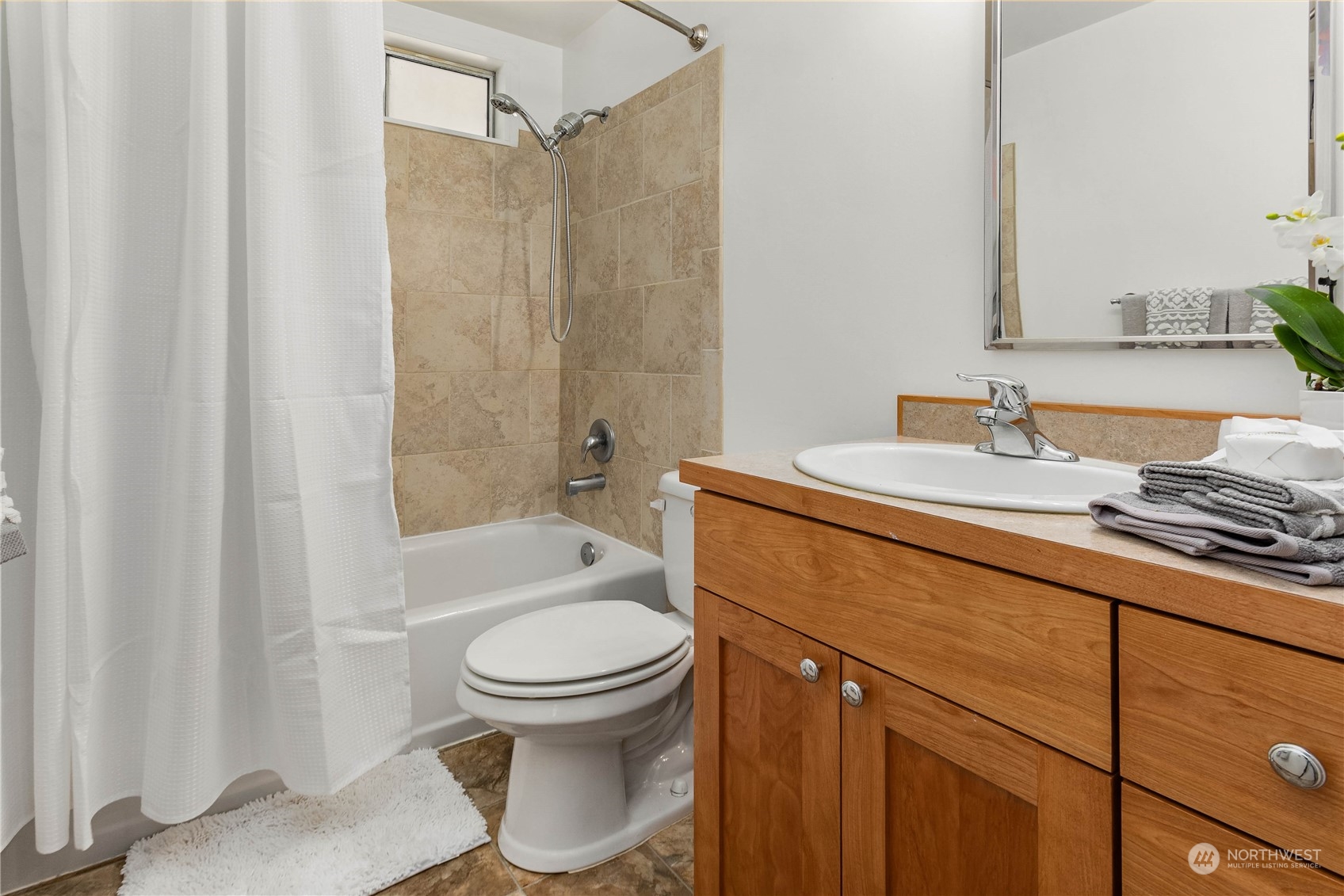 4418 Northeast 18th Court Renton, WA 98059 - Photo 15 of 22 a bathroom with a sink toilet and shower