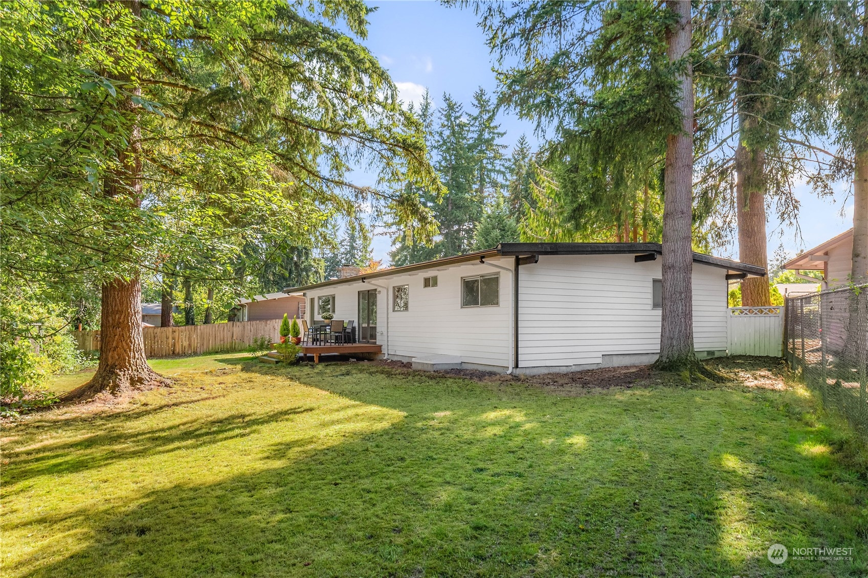 4418 Northeast 18th Court Renton, WA 98059 - Photo 19 of 22 a view of a backyard with a large tree