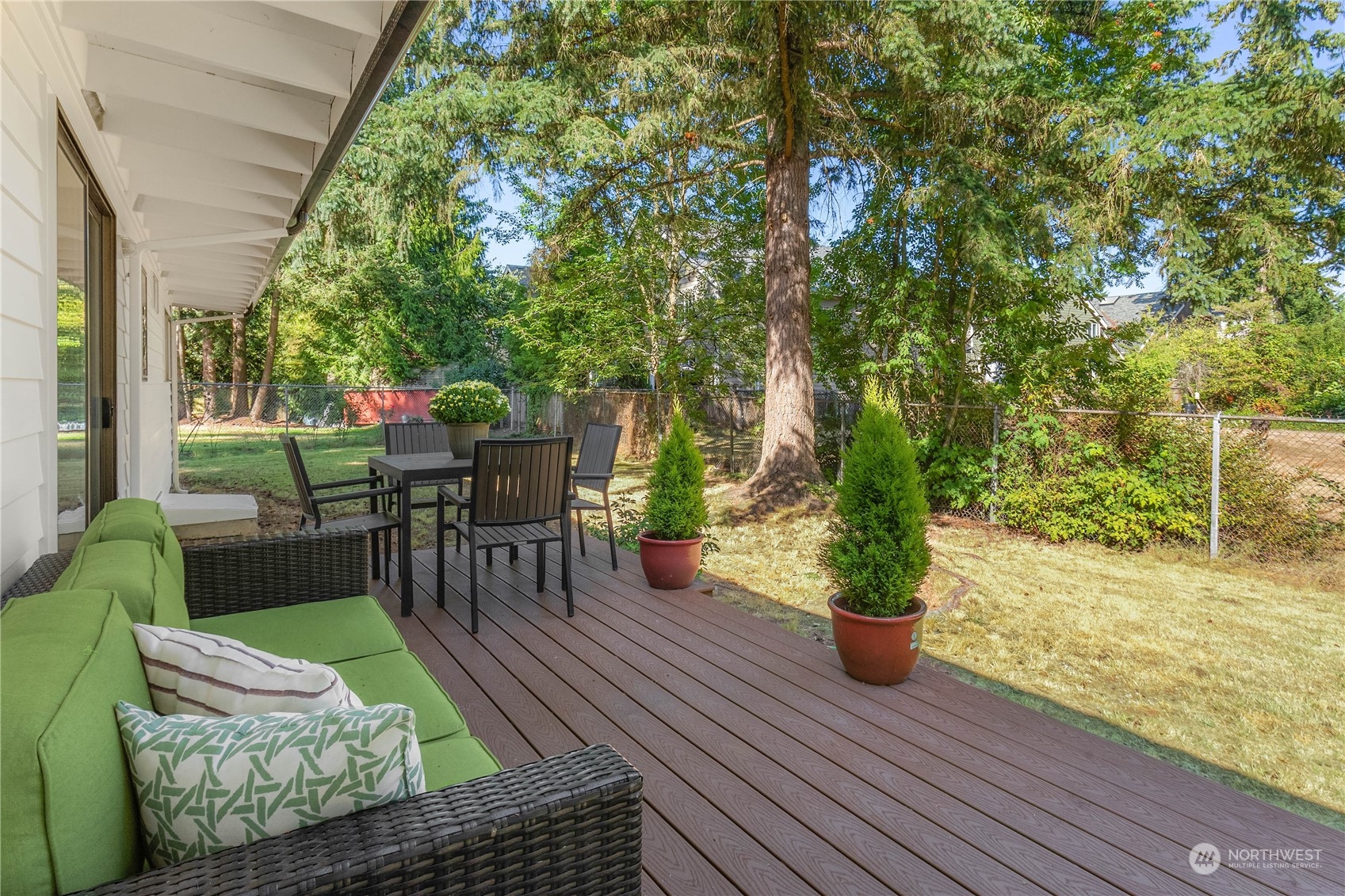 4418 Northeast 18th Court Renton, WA 98059 - Photo 20 of 22 a view of a porch with furniture and a yard