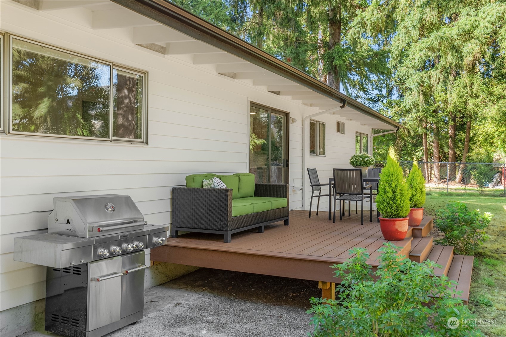 4418 Northeast 18th Court Renton, WA 98059 - Photo 22 of 22 a backyard of a house with outdoor seating