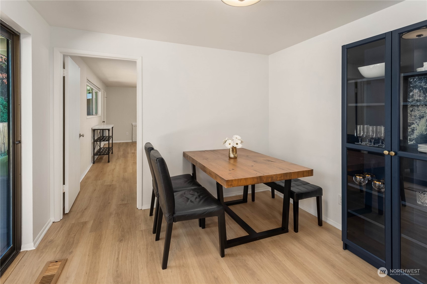 4418 Northeast 18th Court Renton, WA 98059 - Photo 7 of 22 a view of a dining room with furniture and wooden floor