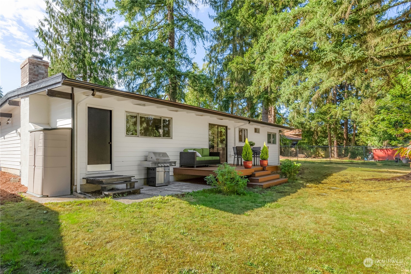 4418 Northeast 18th Court Renton, WA 98059 - Photo 9 of 22 a backyard of a house with seating space