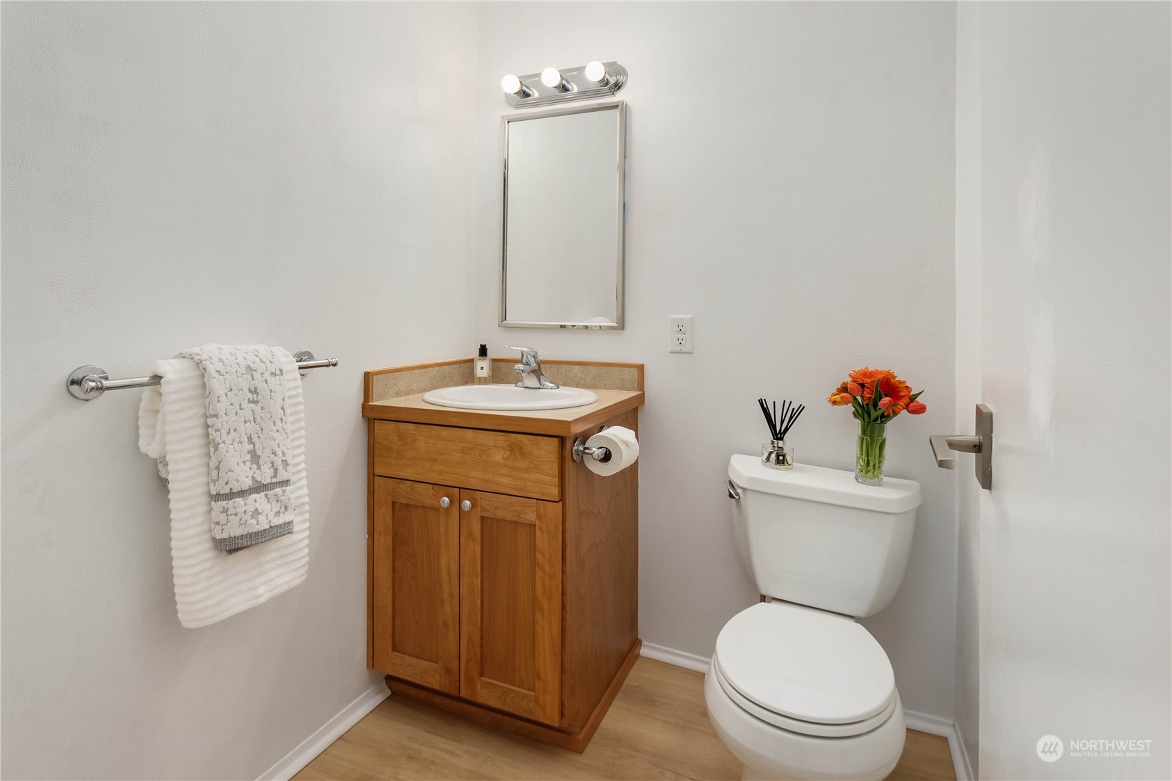 4418 Northeast 18th Court Renton, WA 98059 - Photo 10 of 22 a white toilet sitting next to a bathroom sink