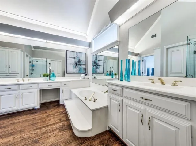 a spacious bathroom with a granite countertop sink mirror and view