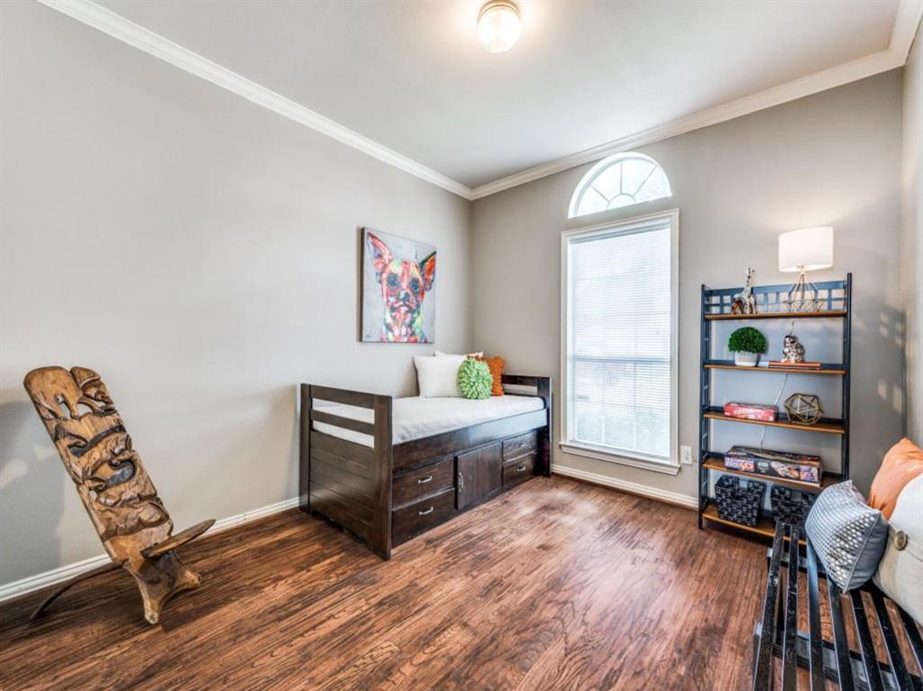 4007 Kirkmeadow Lane Dallas, TX 75287 - Photo 15 of 18 a living room with furniture and a wooden floor