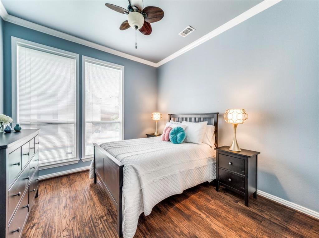4007 Kirkmeadow Lane Dallas, TX 75287 - Photo 17 of 18 a bedroom with a bed and a window